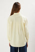 قميص نسائي باللون الأصفر