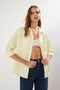 قميص نسائي باللون الأصفر