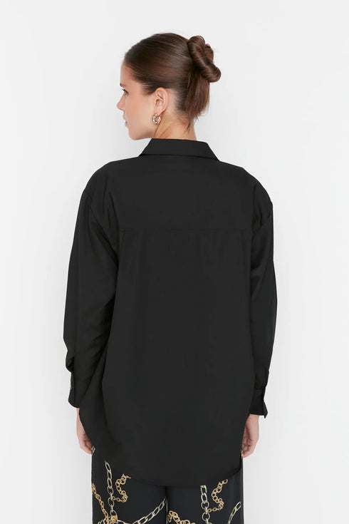 قميص قصّة واسعة باللون الأسود