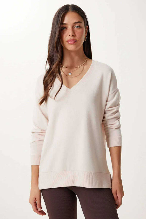 كنزة تريكو باللون البيج الفاتح